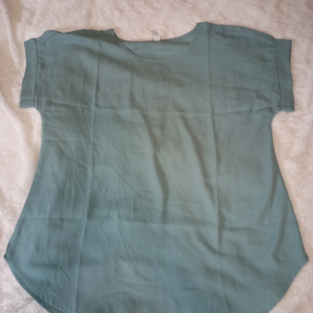 Sheer turquoise blouse